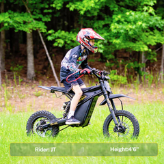 Young rider using the Heybike Villain on a wooded trail.