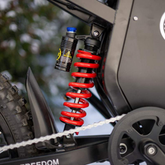FreeGo X3 Pro All-Terrain Electric Dirt Bike rear suspension detail