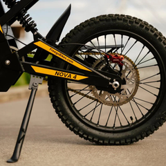 FreeGo Nova 4 Mid-Drive Electric Dirt Bike rear wheel and brake detail