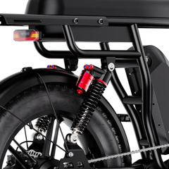 Close-up of the Heybike Saturn rear suspension, shock absorber, and Heybike-branded tail light.