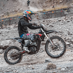 Rider using the MotoTec Venom 72V 12000W Electric Dirt Bike off-road