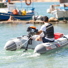 Aqua Marina AIRCAT 3.35m Inflatable Catamaran on water with outboard motor attached