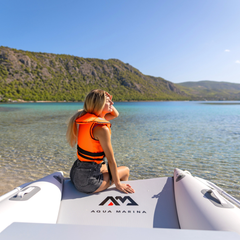 Aqua Marina AIRCAT 3.35m Inflatable Catamaran on lake with person seated at the bow