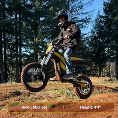 Rider seated on a Classic yellow Heybike Villain in a wooded area.