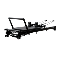 Align-Pilates C8-Pro Noir Reformer Black angled view showing black reformer frame, carriage, footbar, shoulder rests, and rope system
