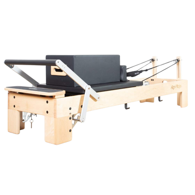 Align-Pilates M8 Pro Maple Reformer + Pro Sitting Box angled view showing maple frame, carriage, footbar, ropes, and sitting box