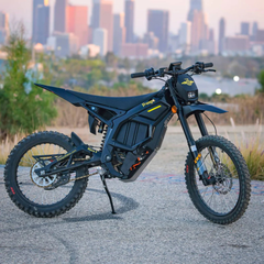 FreeGo Nova 5 Mid-Drive Off-Road Electric Dirt Bike black side view with city background