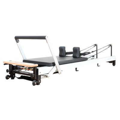 Align-Pilates C8 Pro Reformer angled view showing reformer frame, carriage, shoulder rests, footbar, and rope system