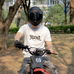 Rider Wearing Yozma Dirt Bike Helmet on a Dirt Bike