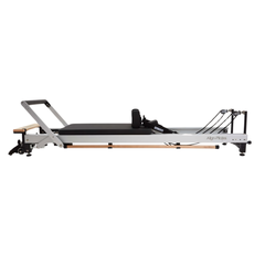 Align-Pilates C8 Pro Reformer side view showing full reformer length, carriage, footbar, and ropes