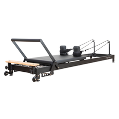 Align-Pilates R8-Pro Light Commercial Reformer Black angled view showing reformer frame, carriage, shoulder rests, footbar, and rope system