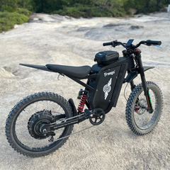 FreeGo X3 Pro All-Terrain Electric Dirt Bike black rear angle rocky terrain view