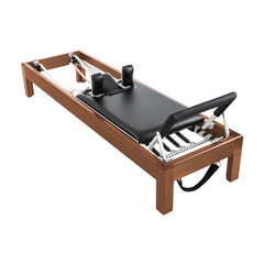 Angled view of Legacy Pilates Apparatus 80" Teak Pilates Reformer