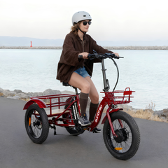 Rider using the red Eunorau NEW-TRIKE 2.0 outdoors