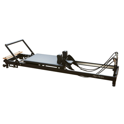 Align-Pilates R8-Pro Light Commercial Reformer Black angled side view showing carriage platform, shoulder rests, footbar, and frame