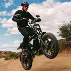 Rider performing a wheelie on the Heybike Saturn electric bike.