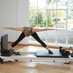 Align-Pilates C8 Pro Reformer in use for standing Pilates reformer exercise