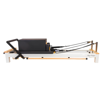 Align-Pilates C8-S Reformer side view showing jump board, carriage, footbar, and rope system