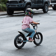 Himiway C1 Kids eBike in use by child riding on pavement