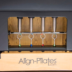 Align-Pilates F3 Folding Home Reformer close-up showing spring system and resistance springs