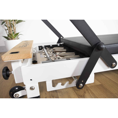 Align-Pilates R8-Pro Light Commercial Reformer White close-up showing frame, footbar, and adjustment details