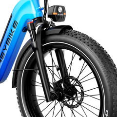 Close-up of the blue Horizon front suspension fork, headlight, fender, and wheel.