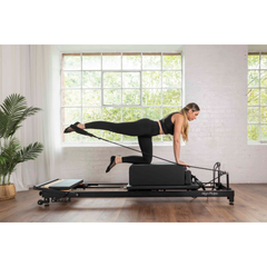 Align-Pilates R8-Pro Light Commercial Reformer Black in use for Pilates reformer exercise