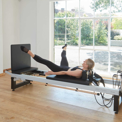 Align-Pilates A8-Pro Reformer Short 28cm Legs in use with jump board for Pilates reformer exercise
