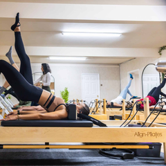 Align-Pilates M8 Pro Maple Reformer + Pro Sitting Box in use for group Pilates reformer class
