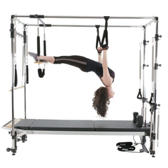 Align-Pilates C8 Pro Reformer with half Cadillac frame in use for suspended Pilates exercise
