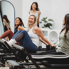 Align-Pilates C8-Pro Noir Reformer Black in use for group Pilates reformer class