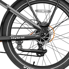 Close-up of the Heybike Hybrid rear wheel, chain guard, and kickstand.