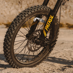 Jasion Patrol 52 front knobby tire and hydraulic disc brake close-up
