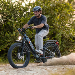 Man wearing a helmet riding the Jasion Thunder electric bike on a dirt trail