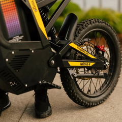 FreeGo Nova 4 Mid-Drive Electric Dirt Bike rear suspension and wheel detail