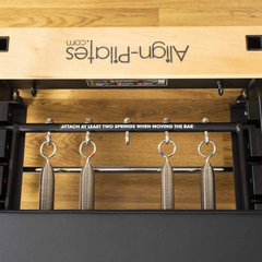 Align-Pilates R8-Pro Light Commercial Reformer Black close-up showing spring system and resistance springs
