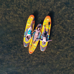 Aqua Marina AMgo Turbo 330 with BlueDrive S Power Fin Set overhead view on water with person standing