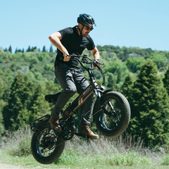 Rider riding the Jasion Hunter Pro electric fat tire bike outdoors
