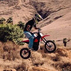 Yozma IN 10 Red Electric Dirt Bike Ridden on an Off-Road Trail