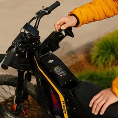 FreeGo Nova 4 Mid-Drive Electric Dirt Bike battery cover detail