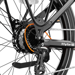Close-up of the Heybike Hybrid rear derailleur, chain, and wheel hub.