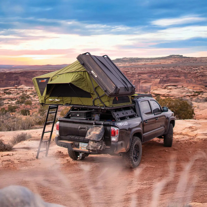 23ZERO Armadillo AX3 aluminum hard shell rooftop tent mounted on vehicle roof rack, closed transit position
